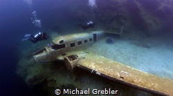 Two divers reach the airplane sunk in Morrison's Quarry. ... by Michael Grebler 
